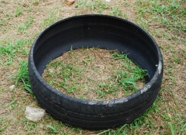 tire gardening,making concrete posts,making drainage holes in tires,uses for old tires