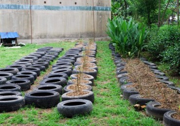 tire gardening, making concrete posts, making drainage holes in tires, uses for old tires,